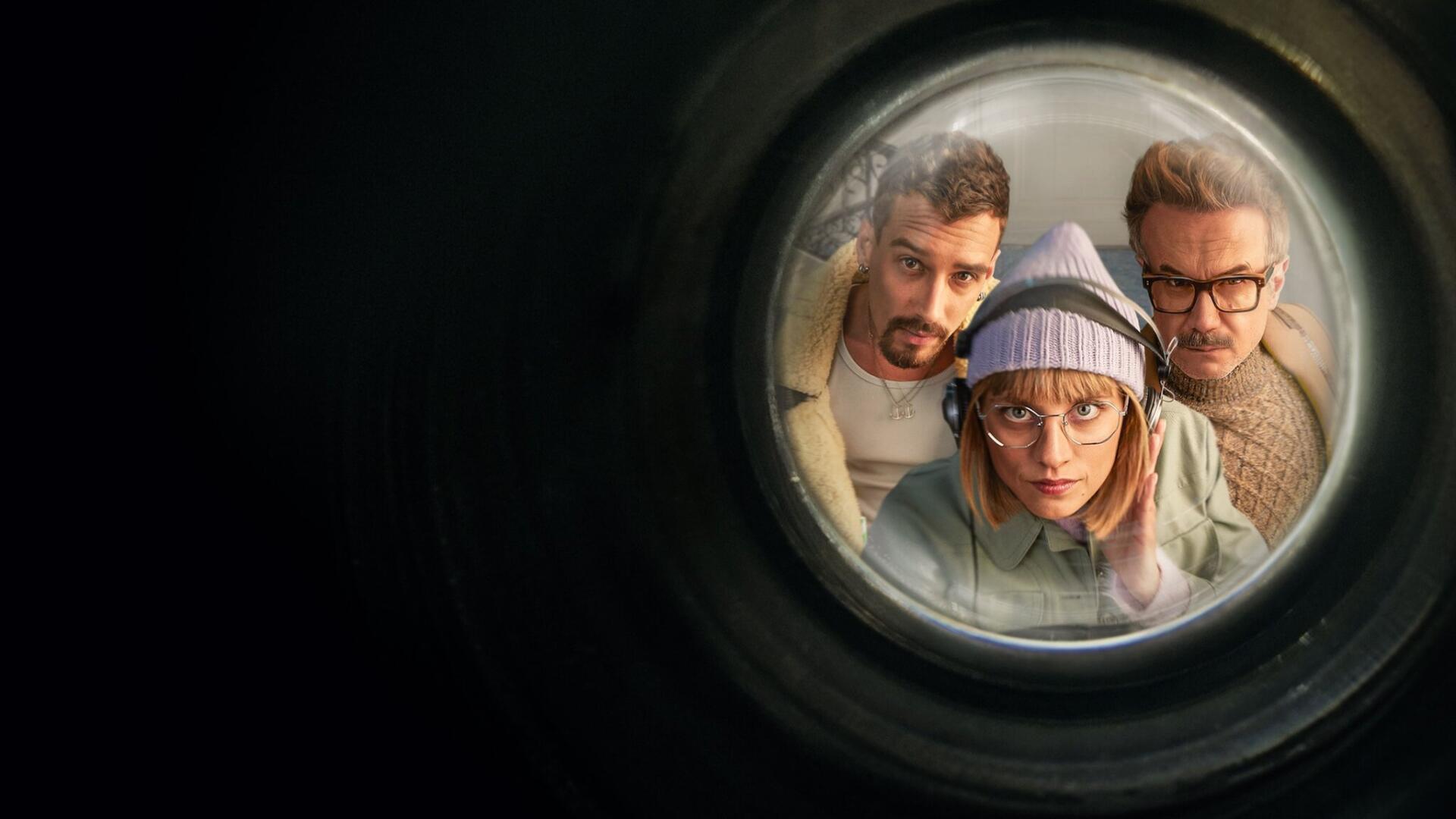 HD PC desktop wallpaper showing Berlin (La Casa De Papel) with two allies peering through a round porthole into a dark, cinematic background.