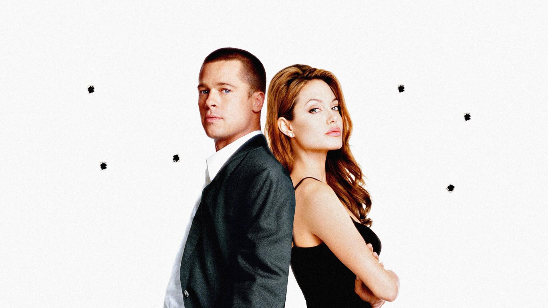 Two actors posed back-to-back in a Mr. & Mrs. Smith poster-style 2K Quad HD PC desktop wallpaper, white background dotted with small bullet holes.