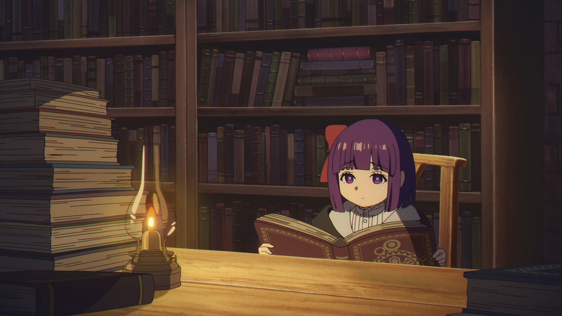 HD PC anime desktop wallpaper of Fern from Frieren: Beyond Journey's End reading by lamplight in a cozy library, stacks of books and shelves behind her.