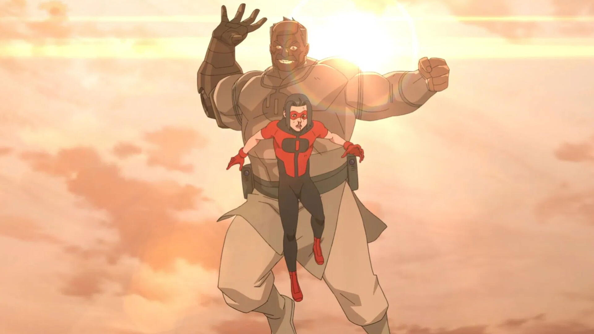 Invincible 2K Quad HD PC desktop wallpaper: Invincible flies forward in red-and-blue as a towering, armored ally rises behind him, both backlit by a warm, golden cloud-filled sky.