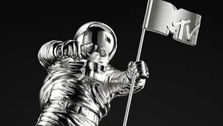 Shiny chrome MTV Moonman astronaut holding an MTV flag on a black background — HD PC desktop wallpaper/background themed around music and MTV.
