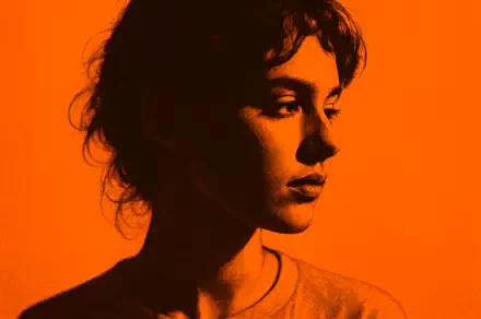 Orange aesthetic, high-contrast profile portrait of a woman in cinematic silhouette — 4K Ultra HD PC desktop wallpaper and background.