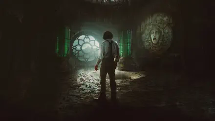 Frankenstein (2025) 4K Ultra HD PC desktop wallpaper: lone figure in a ruined, dim lab illuminated by a glowing circular window and an ominous carved stone face.