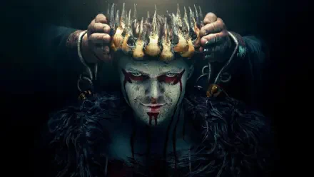 Vikings (2013) 4K Ultra HD PC desktop wallpaper: pale, painted-faced warrior with blood-red eye makeup and smeared blood, dark fur cloak, chained hands lowering a jagged spiked crown.