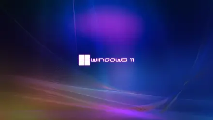 Microsoft Windows 11 5K Ultra HD PC desktop wallpaper: glowing abstract blue and purple light gradient with a centered Windows 11 logo.