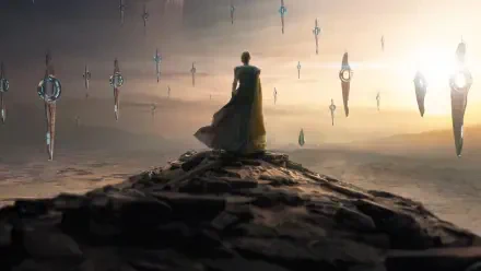 Cloaked figure on a rocky ridge overlooking a misty landscape dotted with floating monoliths at sunrise - Foundation 4K Ultra HD PC desktop wallpaper and background.