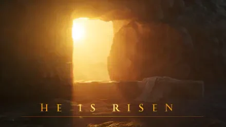 2K Quad HD PC desktop wallpaper showing a sunlit empty tomb with open stone door and radiance, with He Is Risen text — a Biblical Christian resurrection scene.