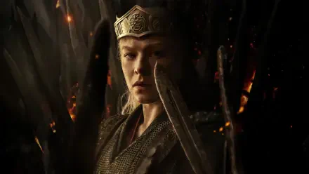 Rhaenyra Targaryen from the TV show House of the Dragon, crowned and armored, sword raised before a smoldering throne — 4K Ultra HD PC desktop wallpaper/background.