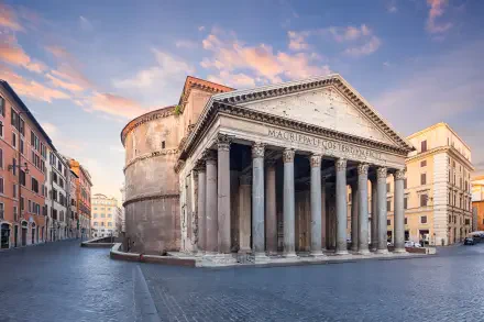 2K Quad HD PC desktop wallpaper and background of the Pantheon in Rome, Italy — classical Corinthian portico and rotunda bathed in warm sunset light, surrounded by city buildings.
