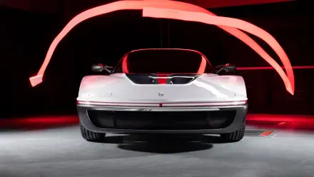 Front view of a white Bertone Runabout vehicle with red light trails on a dark studio floor — 4K Ultra HD PC desktop wallpaper and background.