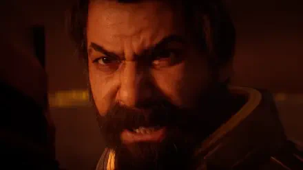 Close-up of bearded, enraged video game character Saros in warm orange light — dramatic 4K Ultra HD PC desktop wallpaper and background.