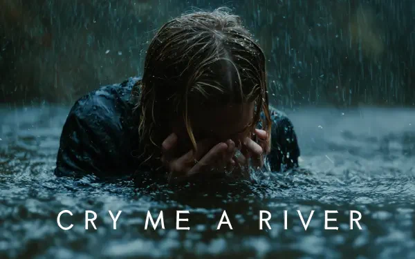 4K Ultra HD PC wallpaper: a person crouched in a downpour, hands covering their face in rippling water, with the bold caption CRY ME A RIVER.