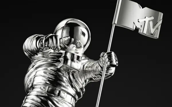 Shiny chrome MTV Moonman astronaut holding an MTV flag on a black background — HD PC desktop wallpaper/background themed around music and MTV.