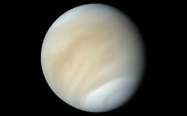 HD PC desktop wallpaper: close-up of a cloud-shrouded planet in space, pale cream swirls against a black background.