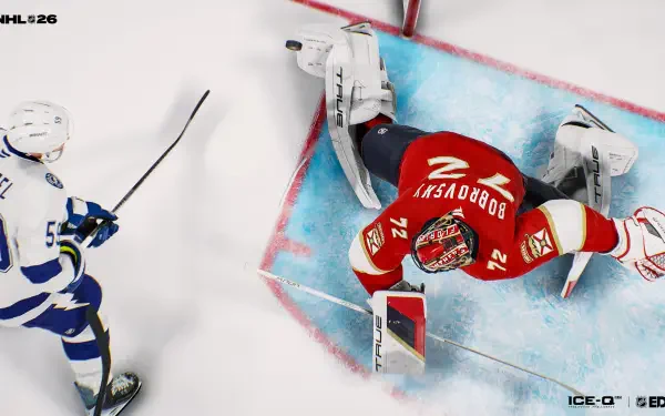 Top-down NHL 26 video game 4K Ultra HD PC desktop wallpaper: red-jersey goalie sprawled in the crease making a save as an opposing skater approaches.