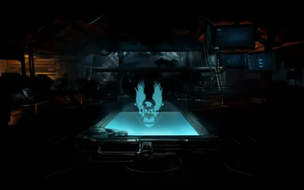 4K Ultra HD PC desktop wallpaper: dim UNSC command room from Halo with a glowing holographic UNSC emblem hovering above a tactical table.