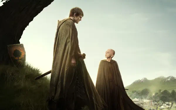 A Knight of the Seven Kingdoms 2K Quad HD PC desktop wallpaper: cloaked knight and young squire on a hill gazing over a misty valley.