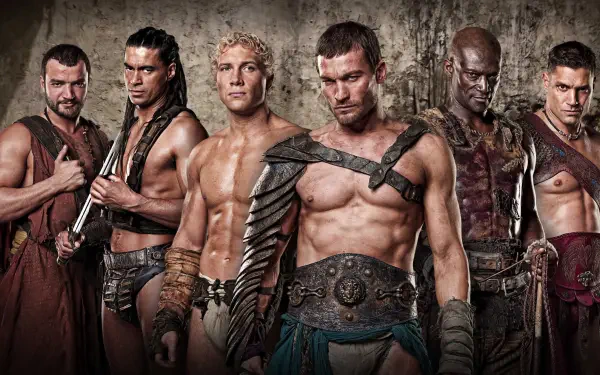 Spartacus: Blood And Sand 4K Ultra HD PC desktop wallpaper — six scarred gladiators in leather armor and weapons posed against a weathered stone wall.