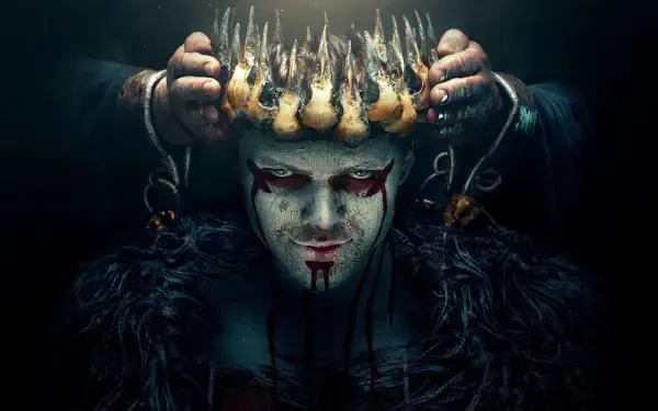 Vikings (2013) 4K Ultra HD PC desktop wallpaper: pale, painted-faced warrior with blood-red eye makeup and smeared blood, dark fur cloak, chained hands lowering a jagged spiked crown.
