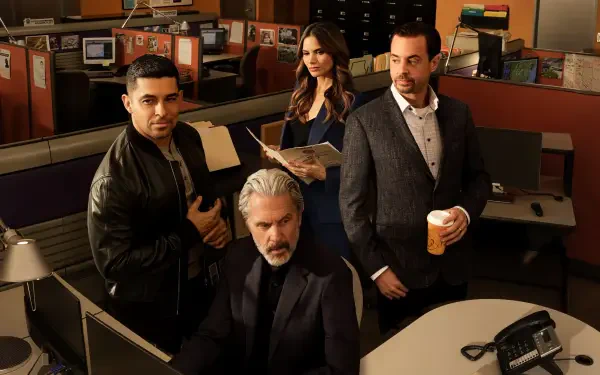 NCIS agents gathered in a dim office around a computer, serious expressions — 4K Ultra HD PC desktop wallpaper/background.