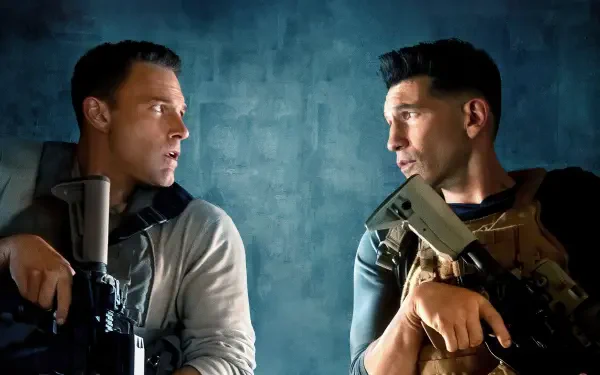 The Accountant 2 4K Ultra HD PC desktop wallpaper: two armed men in tactical gear face off against a textured blue backdrop.