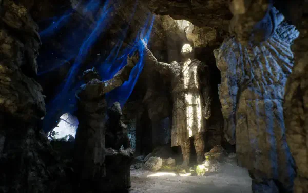 HD PC desktop wallpaper from the video game Solasta II: a cavernous cave lit by beams, showcasing towering stone sculptures and rugged rock formations.