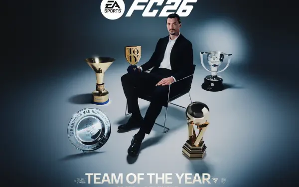 EA Sports FC 26 HD wallpaper: a male soccer star in a suit seated among multiple trophies with Team of the Year text beneath.