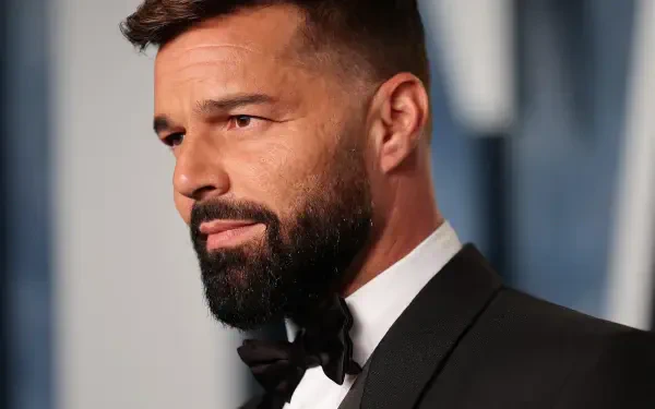 HD PC desktop wallpaper: close-up portrait of a bearded male music celebrity in a tuxedo at a formal event; image tagged Ricky Martin, identity not confirmed.
