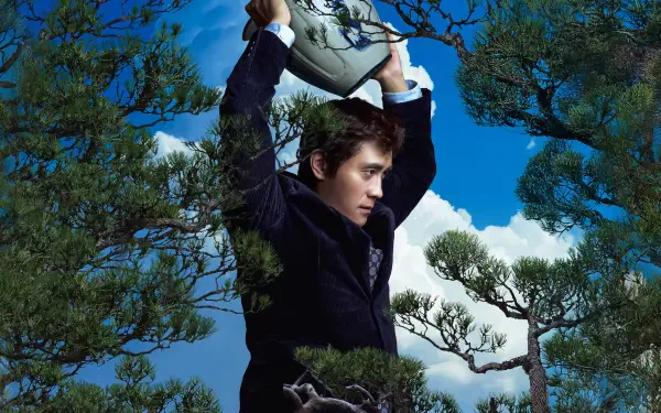 4K Ultra HD PC desktop wallpaper/background: person in a dark coat hoisting a metal basin above their head amid windswept pine branches under a vivid blue sky, titled No Other Choice.