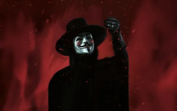 V for Vendetta figure wearing a Guy Fawkes mask and wide-brim hat, black cloak and raised fist against a red smoky background — 5K Ultra HD PC desktop wallpaper/background.