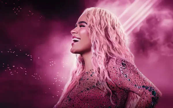 HD desktop wallpaper of a smiling female celebrity reggaeton singer in a sparkling pink outfit with long pink hair, neon pink lights and a smoky background.