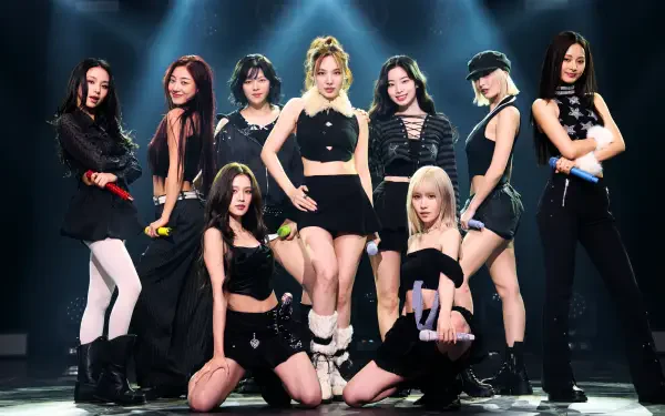 5K Ultra HD desktop wallpaper of a K-pop girl group performing onstage in coordinated black outfits with dynamic lighting, in a JYP Entertainment–style idol concept.
