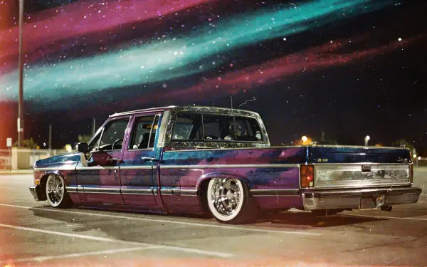 Lowrider truck with iridescent paint and chrome wheels under neon aurora skies — 4K Ultra HD PC desktop wallpaper and background.