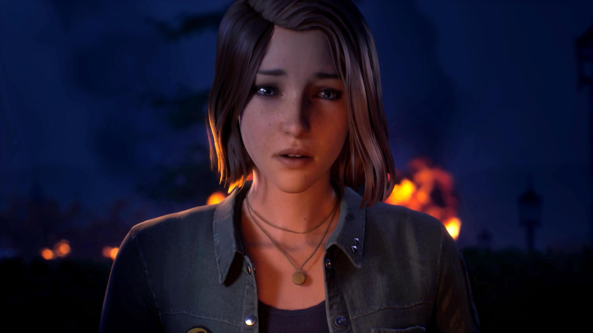4K Ultra HD PC desktop wallpaper from the video game Life Is Strange: Reunion (Life Is Strange) — close-up of a somber young woman lit by distant firelight.