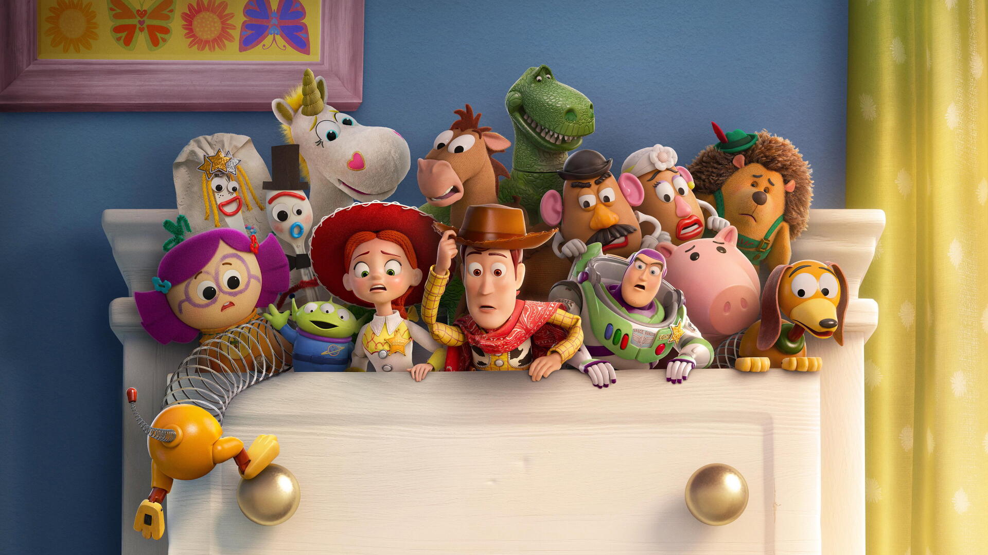 Toy Story 5 image: Toy Story characters peeking over a dresser, colorful group shot — 4K Ultra HD PC desktop wallpaper and background.