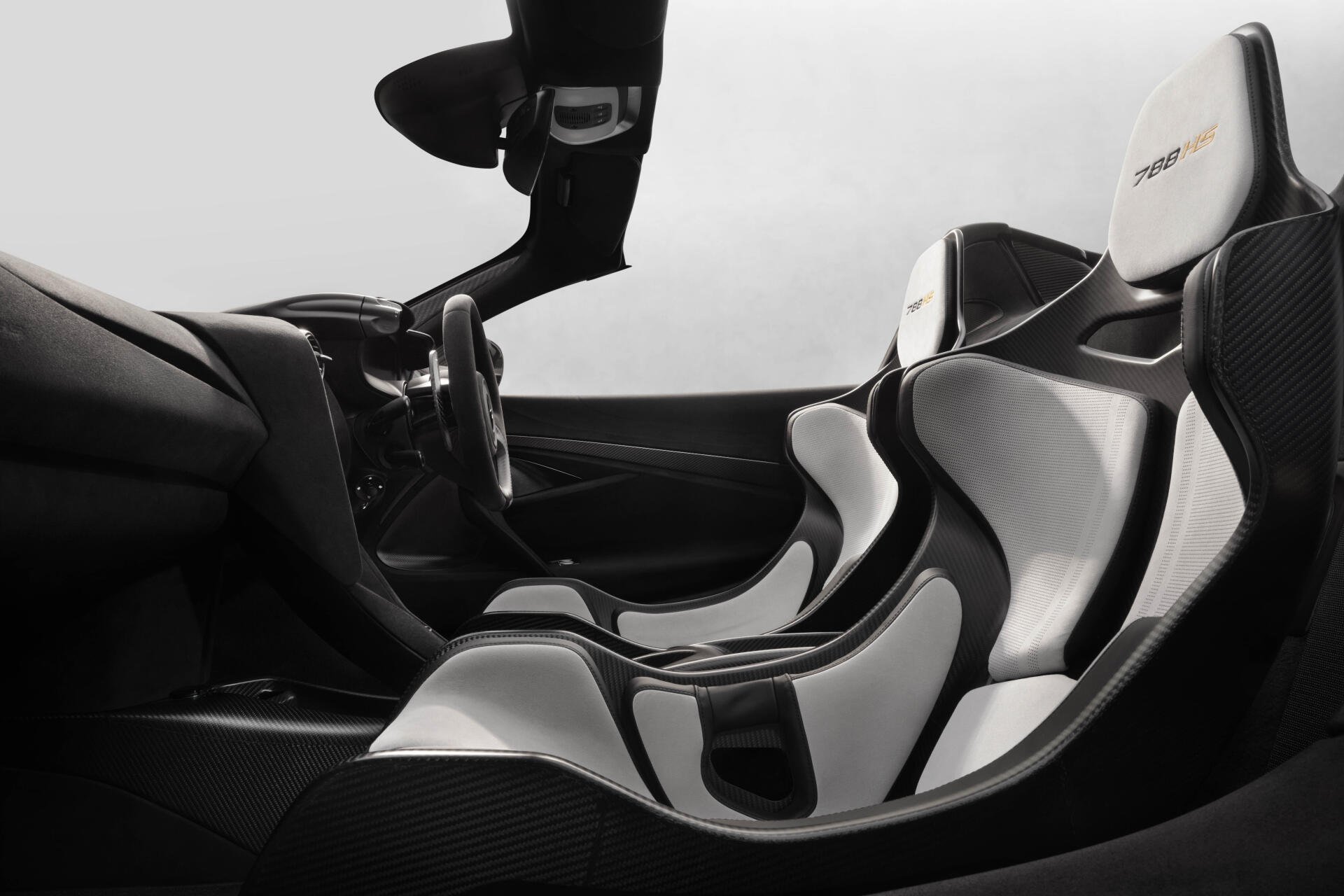 8K Ultra HD PC desktop wallpaper: McLaren 788HS vehicle interior with sleek black-and-white carbon-fiber racing seats and cockpit.