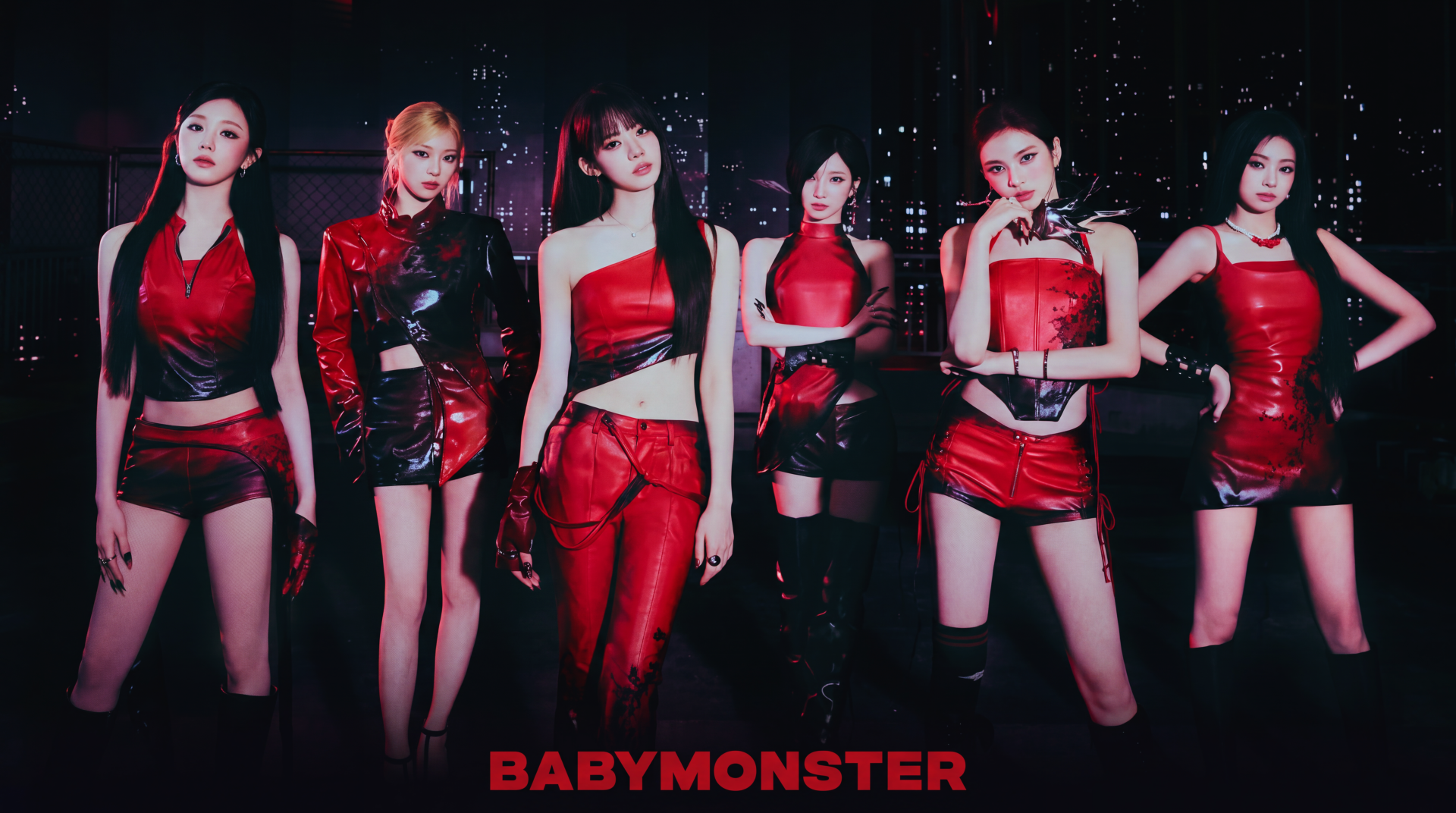 BABYMONSTER K-pop girl group in red stage outfits against a city night skyline, logo at bottom — 5K Ultra HD PC desktop wallpaper, YG Entertainment.
