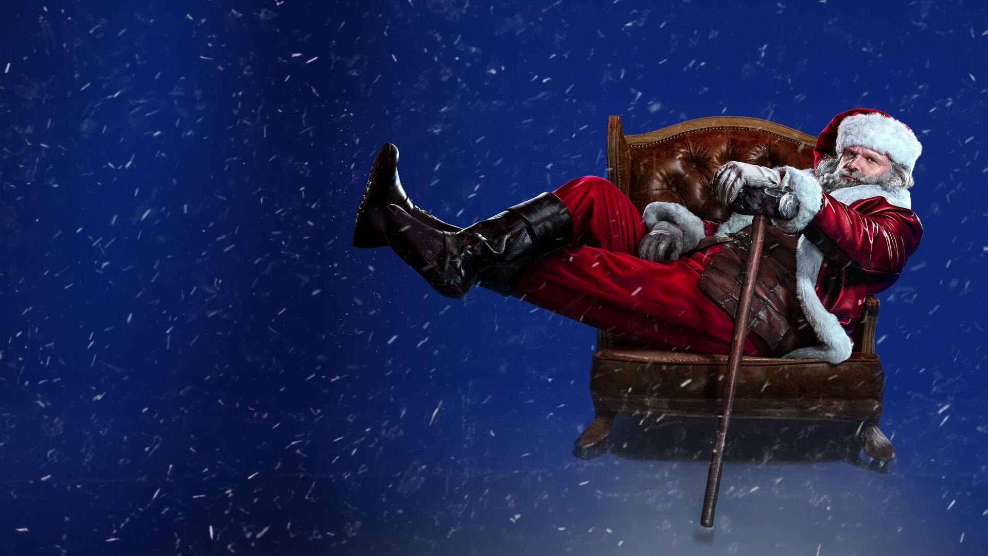 Violent Night 2 4K Ultra HD PC desktop wallpaper: Santa Claus slouched in an armchair, boot kicked out, cane in hand, snow falling against a deep blue night background.