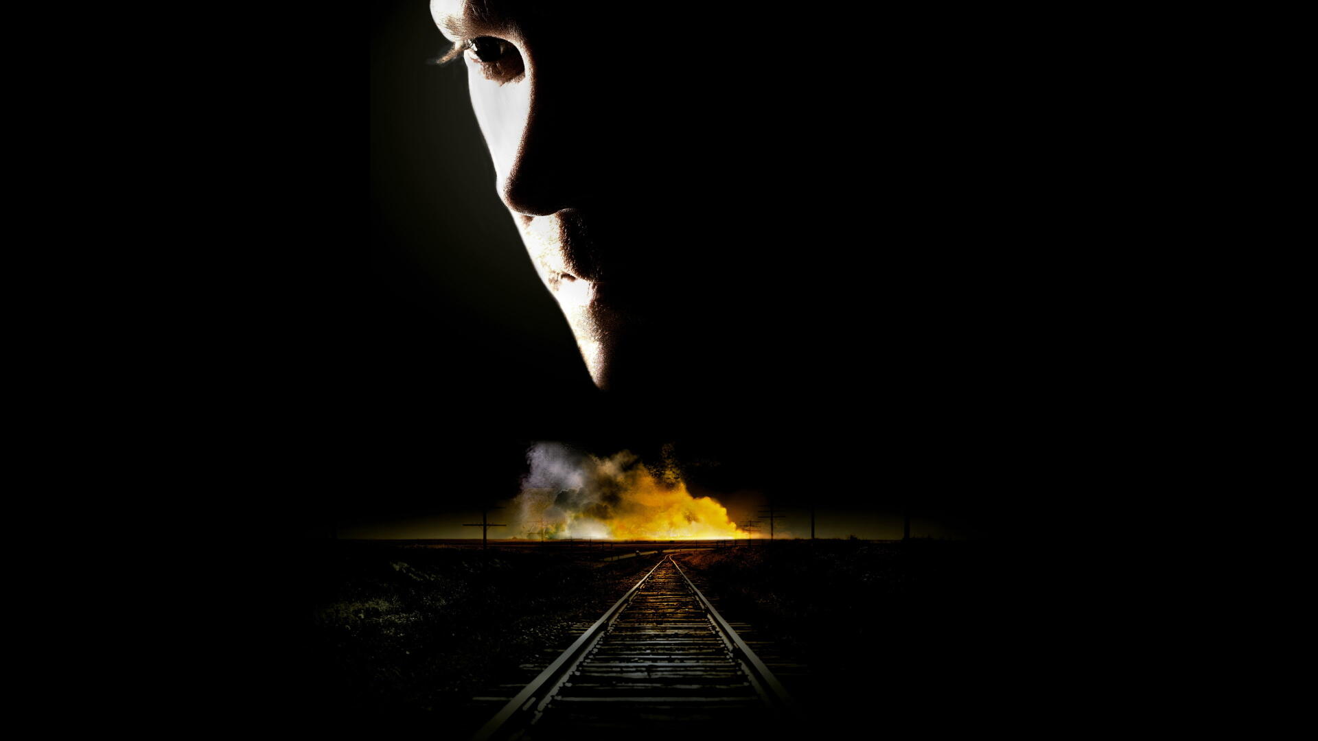 24 — 4K Ultra HD PC desktop wallpaper: shadowed face overlooks railway tracks leading toward a glowing fire in the distance on a stark black background.
