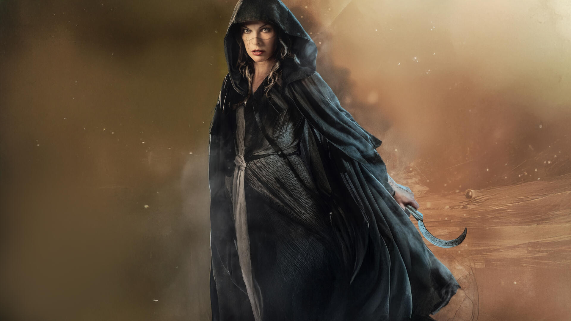 5K Ultra HD PC desktop wallpaper In The Lost Lands: a hooded woman in a dark, flowing cloak strides through a misty, sepia-toned, otherworldly landscape.