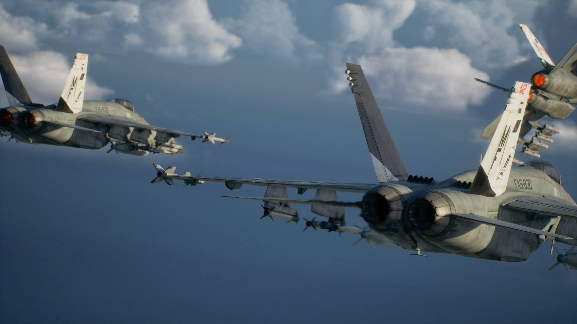 HD PC desktop wallpaper of Ace Combat 8: Wings of Theve jet fighters in tight formation over clouds, close-up on military aircraft engines and wing-mounted missiles.