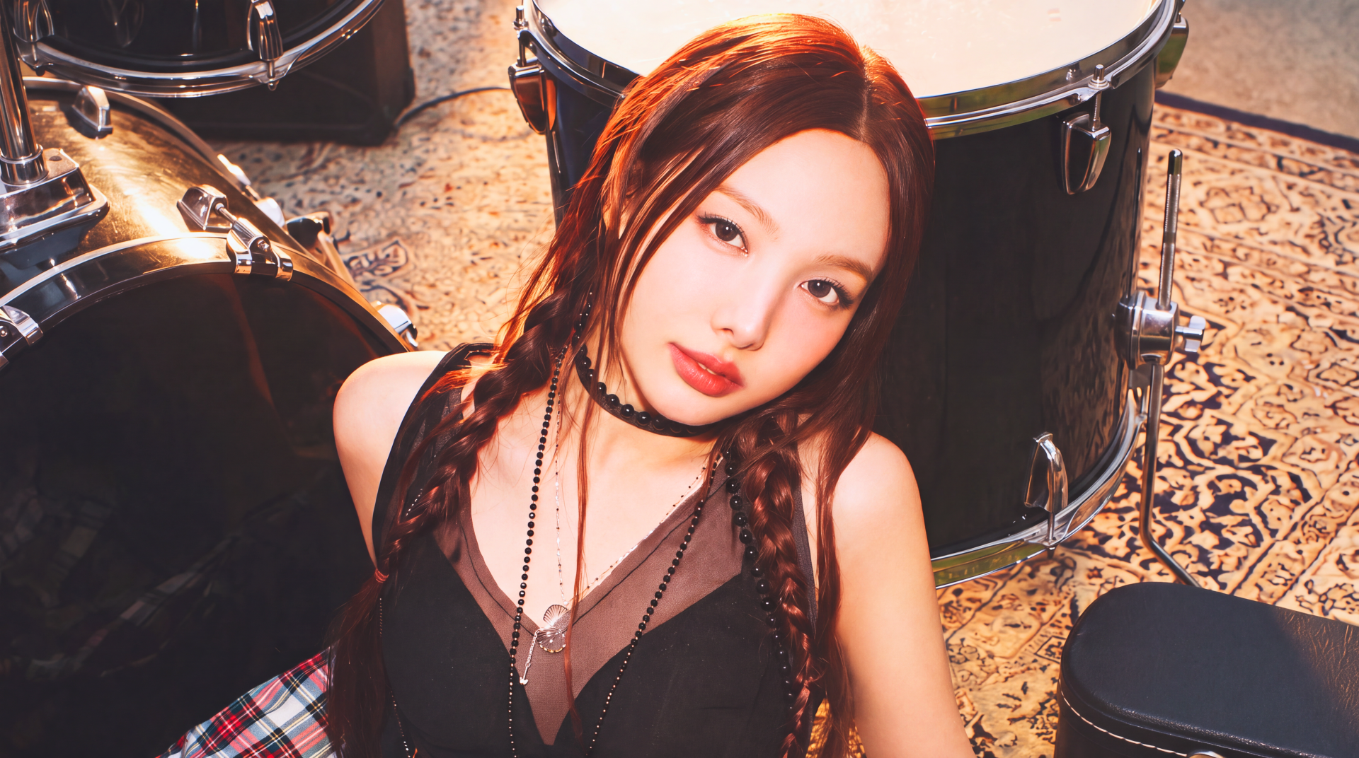 TWICE singer Nayeon in a goth-inspired outfit beside drums, 5K Ultra HD PC desktop wallpaper and background.