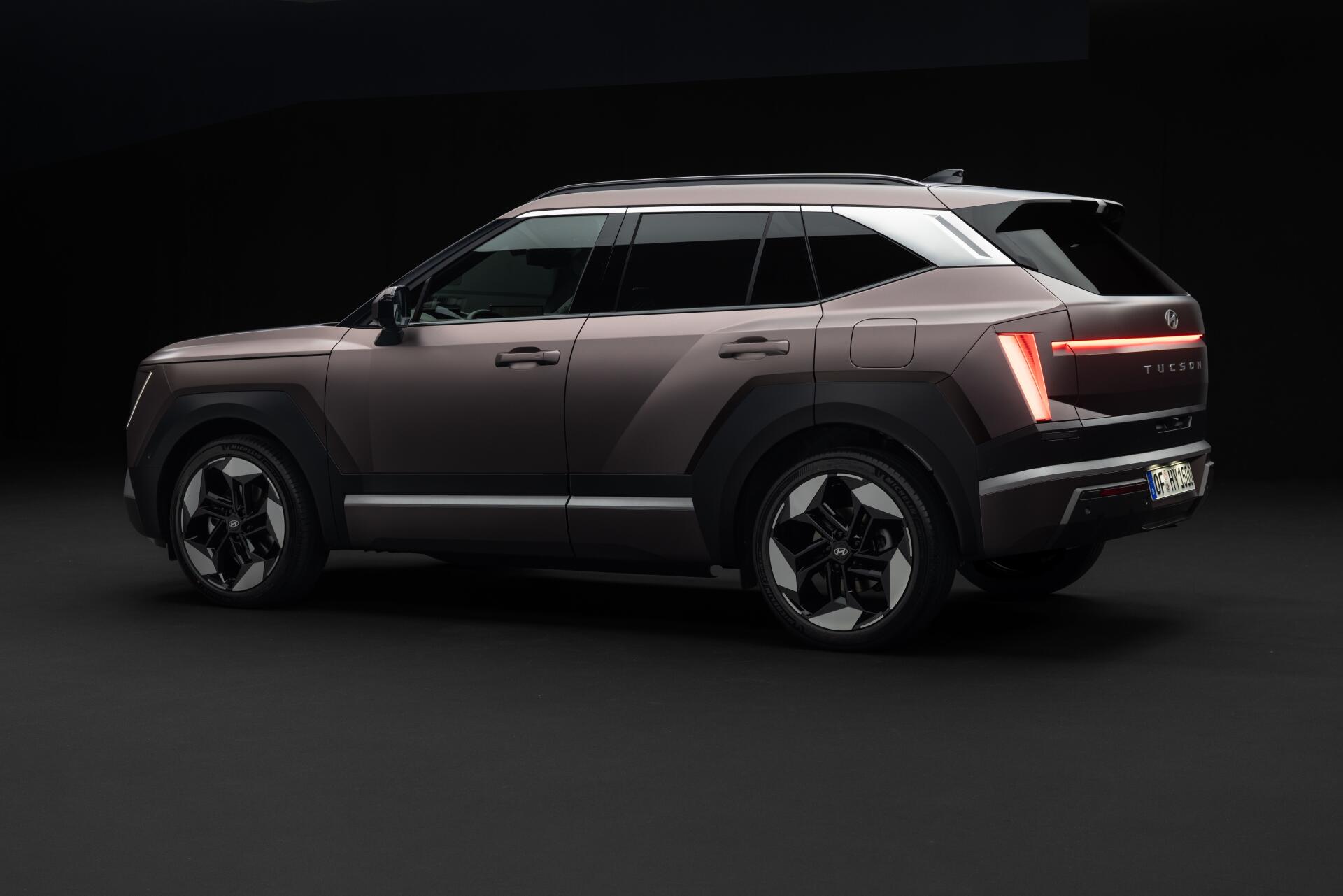 Hyundai Tucson electric SUV in a sleek studio render, featured in an 8K Ultra HD PC desktop wallpaper and background.