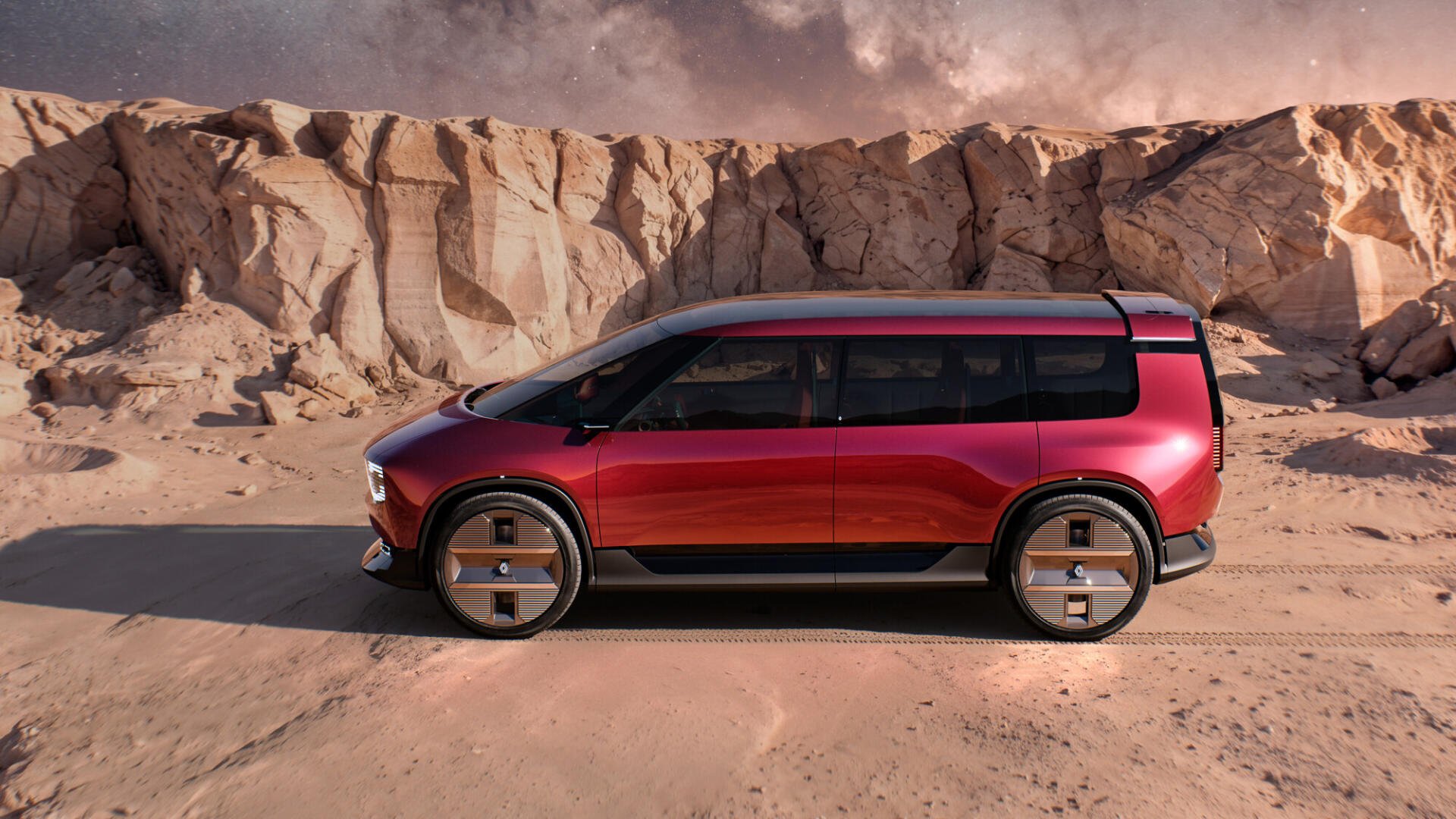 Red Renault E-Space electric SUV against desert cliffs, featured in an HD PC desktop wallpaper background.