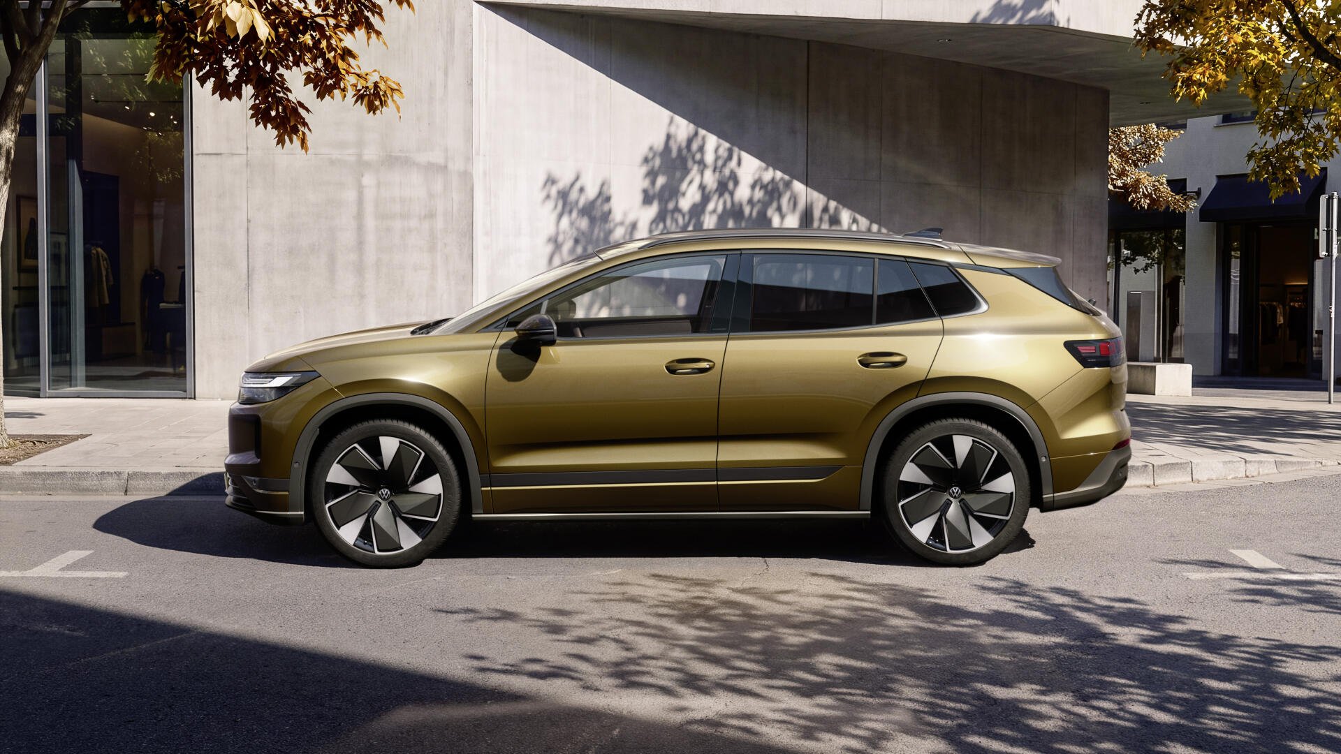 Volkswagen ID. Tiguan electric station wagon parked by modern architecture, 4K Ultra HD PC desktop wallpaper and background.
