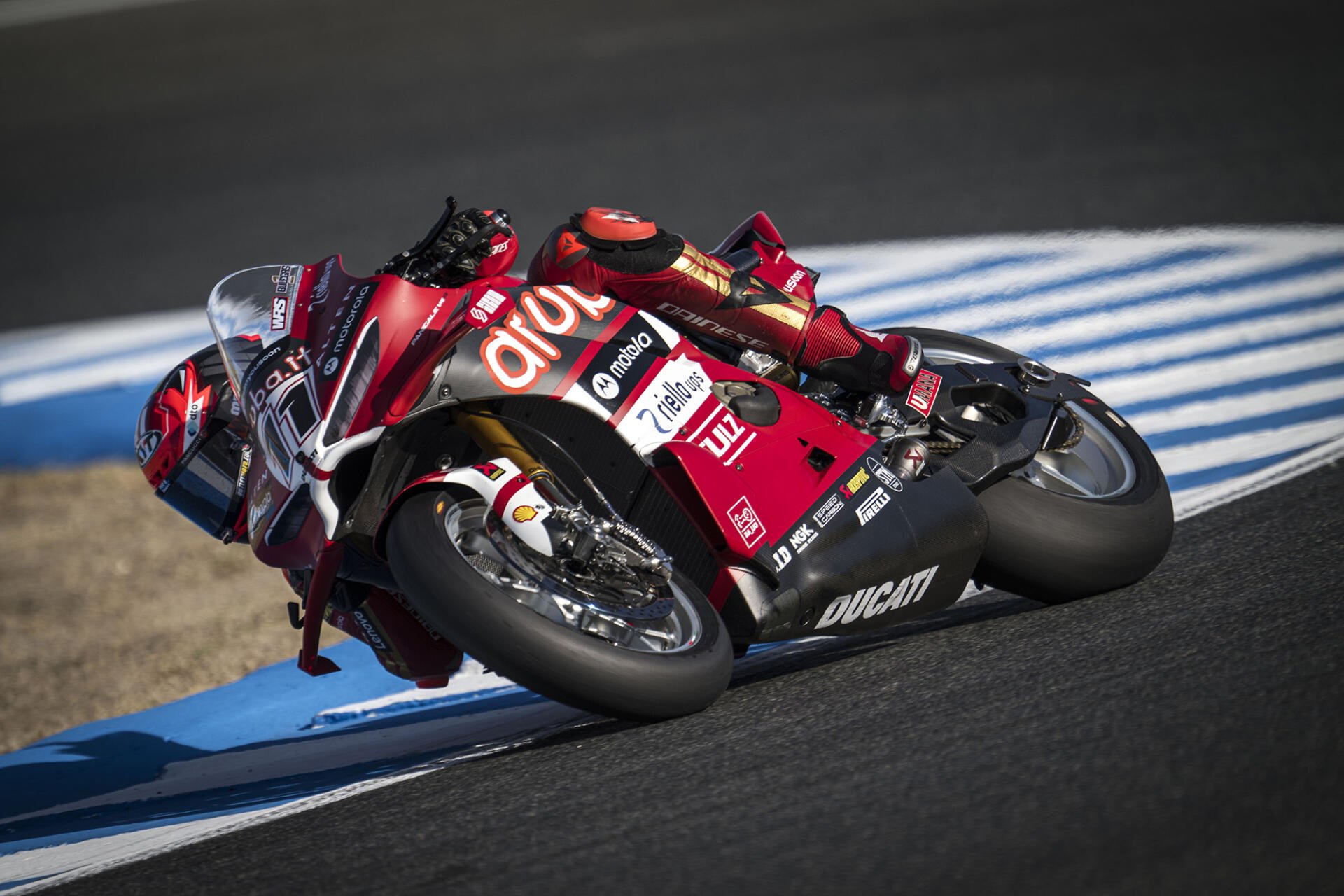Ducati Panigale V4 R motorcycle racing through a circuit corner, HD desktop wallpaper and background