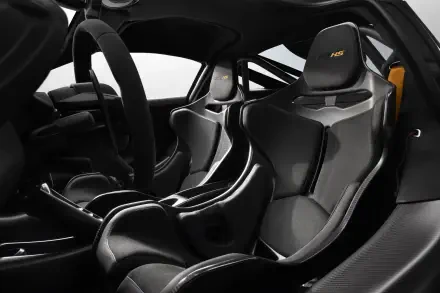 8K Ultra HD PC wallpaper of McLaren 788HS cockpit: carbon-fiber racing seats, sculpted center console and racing steering wheel in matte black and grey.