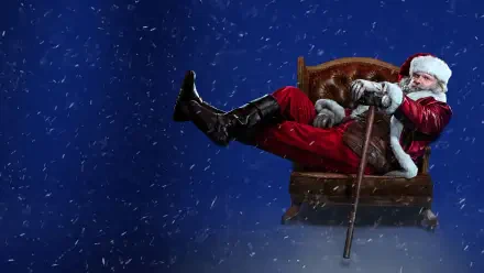 Violent Night 2 4K Ultra HD PC desktop wallpaper: Santa Claus slouched in an armchair, boot kicked out, cane in hand, snow falling against a deep blue night background.