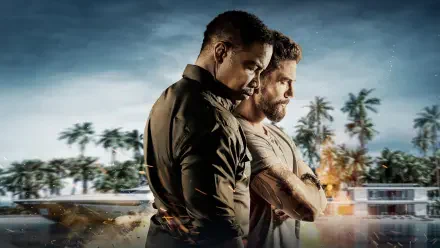 The Island — 4K Ultra HD PC desktop wallpaper of two men standing back-to-back on a tropical beachfront with palm trees, modern buildings and a brooding sky.