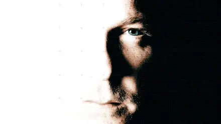 24: 4K Ultra HD PC Desktop Wallpaper and Background — high-contrast close-up of a face split between bright light and deep shadow, a single blue eye visible.